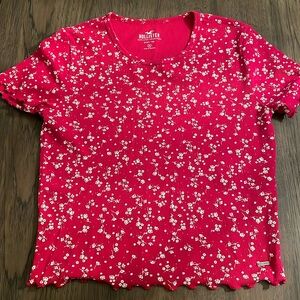 Hollister Baby Tee. Red Floral with scalloped hem sleeve and waist.